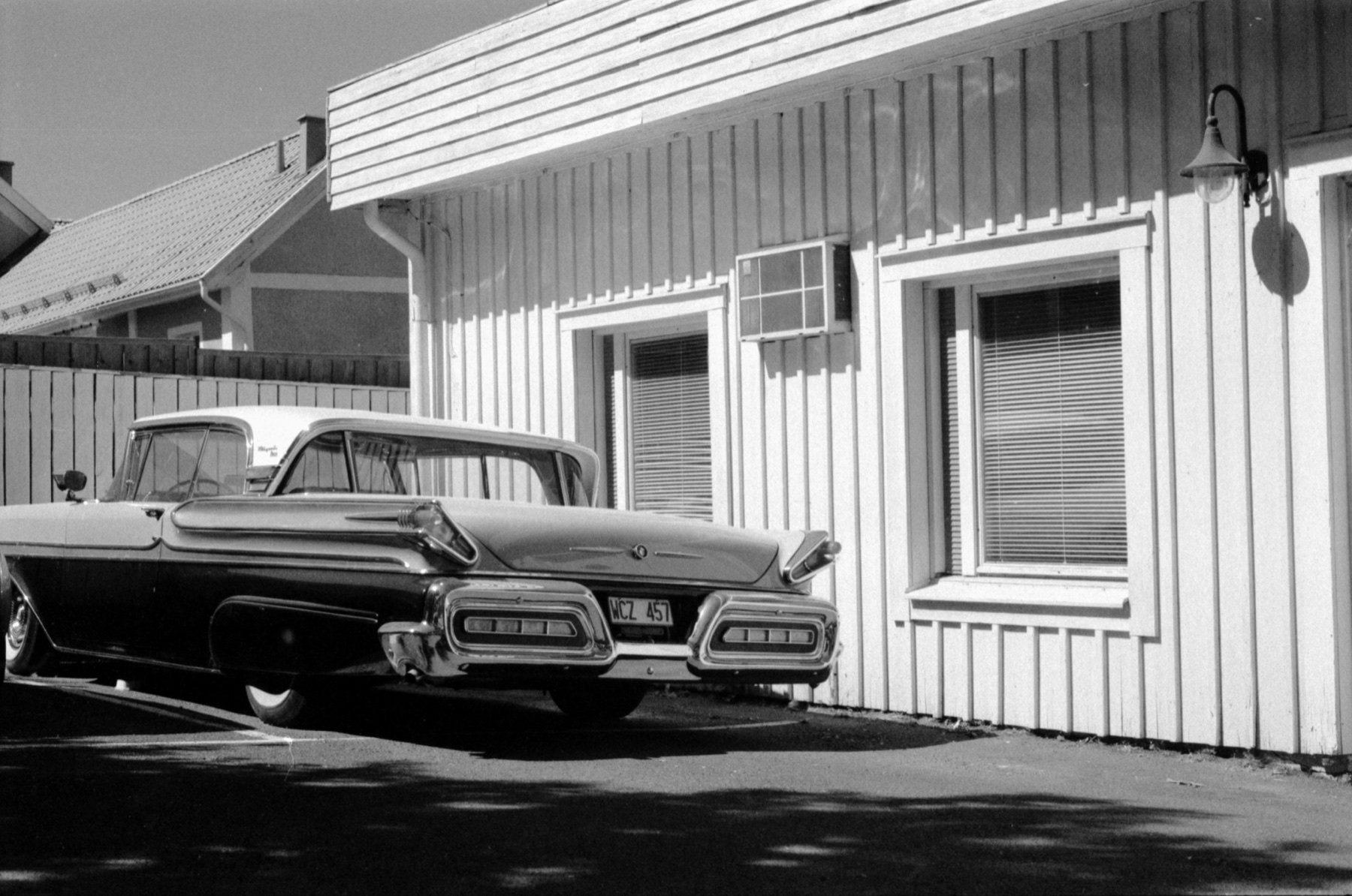 Cars outside a timber building